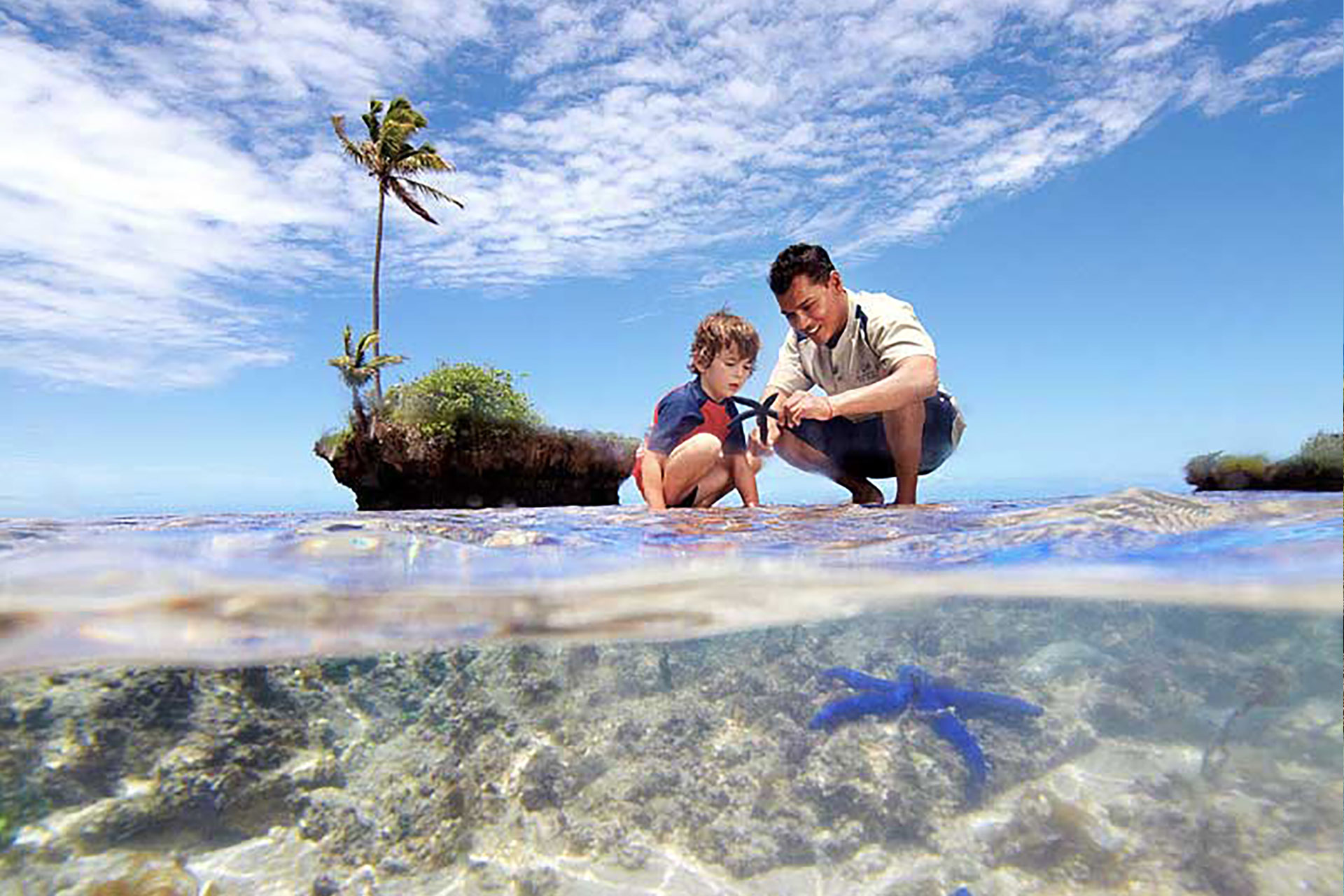 Families-4-luxury-family-vacation-in-fiji An image of a child discovering the magic of Fiji's underwater world with the resort's resident marine biologist.
