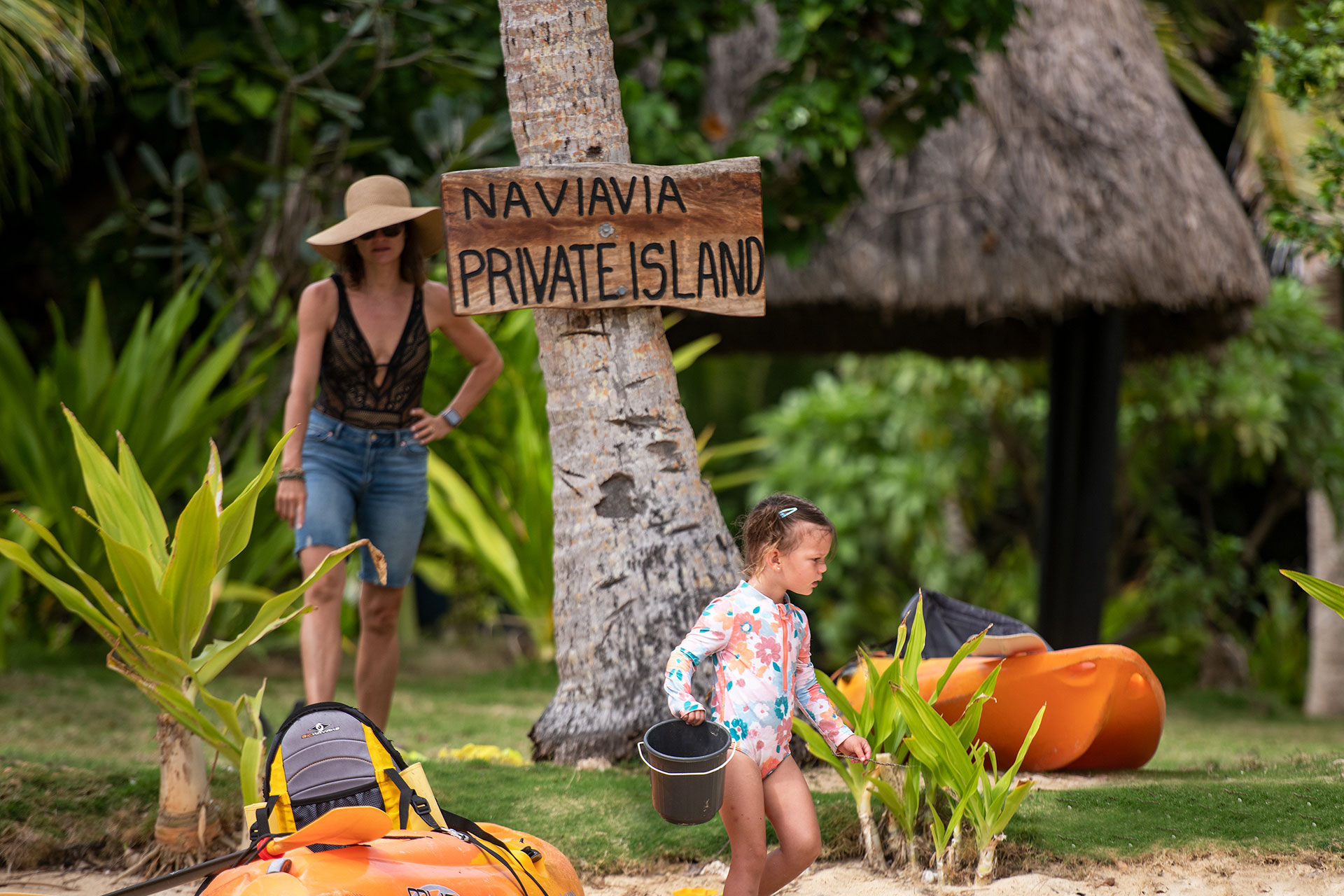 Multigenerational-4-Large-Family-Vacation-Fiji Image shows a mother spending time with her daughter busy at play at the beach. Tiny explorers also love Kids Bula Club, while grandparents and parents reconnect.