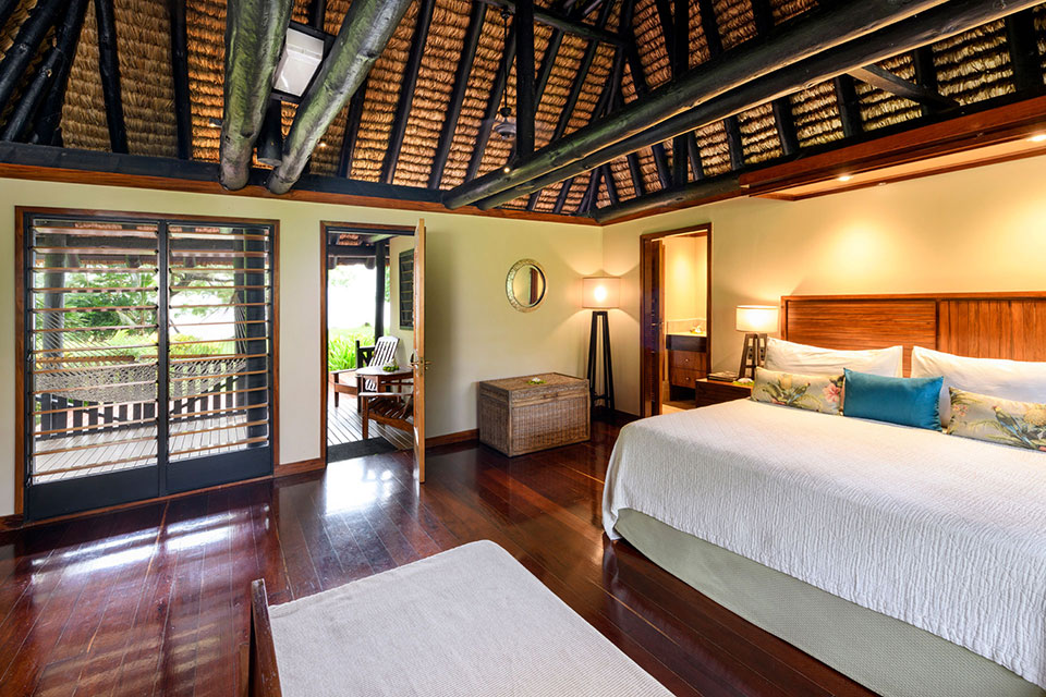 fiji-oceanfront-beach-resort-2-bedroom-bure2 An image of a Fijian style Oceanfront 2-bedroom bure with contemporary furnishings at Jean-Michel Cousteau Resort Fiji.